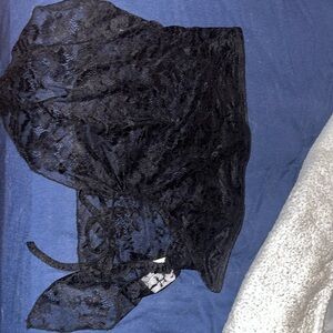 Blouse, covers the boobs and has a see through tummy. Smaller boobs recommended